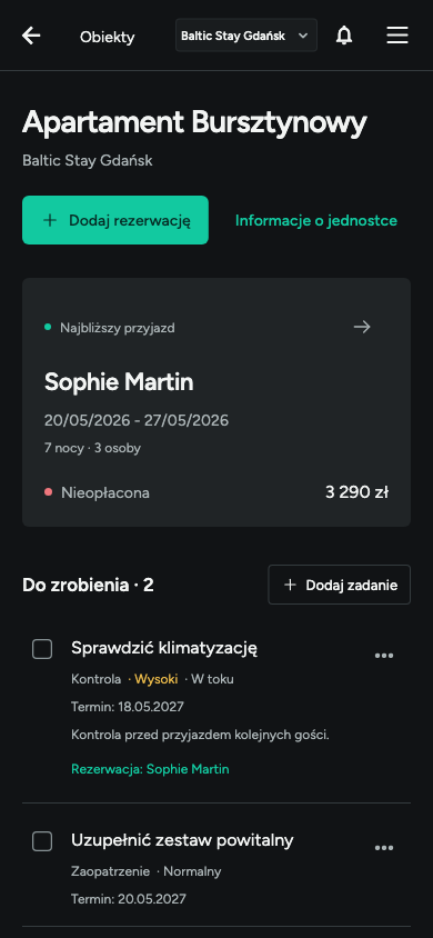 Ekran apartamentu na telefonie w ciemnym motywie.